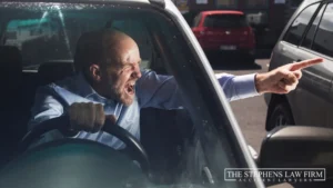 Man yelling in the drivers seat of a car in Houston traffic